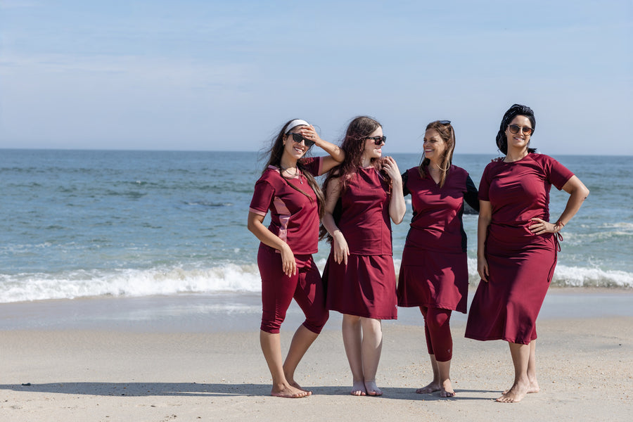Women in HydroChic modest swimwear on the beach